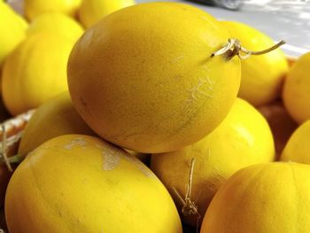 Close-up of fresh yellow melons in market