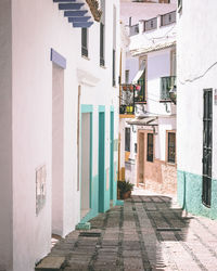 Alley amidst buildings in city