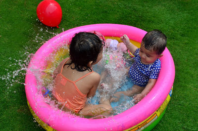 Children playing in swimming pool