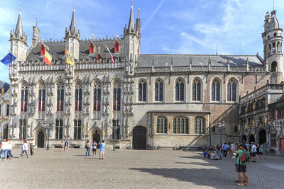 People in front of historical building