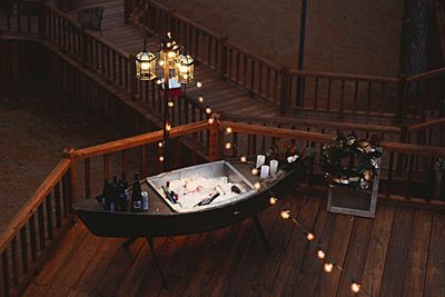 High angle view of wine bottles on floorboard at wedding ceremony