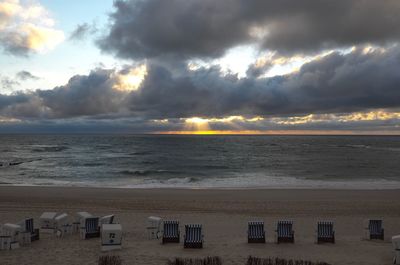 Scenic view of beach against sky during sunset