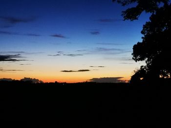 Scenic view of silhouette landscape against sky at sunset