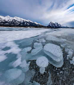 Scenic view of snowcapped mountains against sky during winter