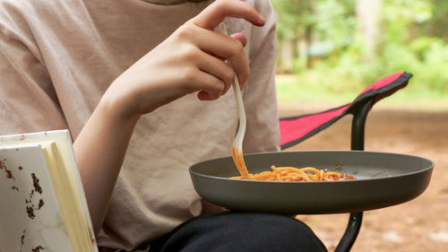 Midsection of man preparing food