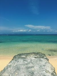 Scenic view of sea against blue sky