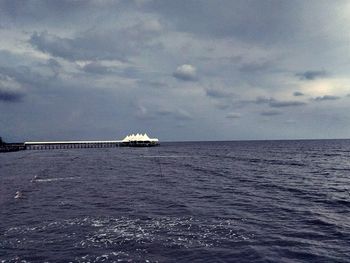 Boat sailing in sea against sky