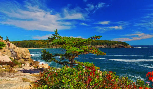 Scenic view of sea against cloudy sky