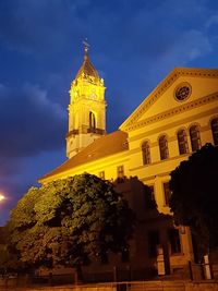 Low angle view of clock tower against sky