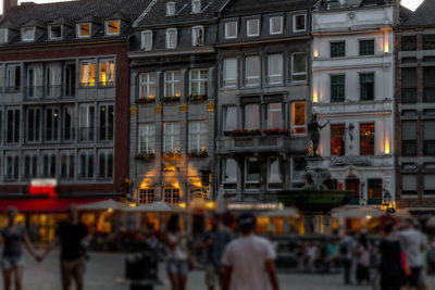 People walking in front of buildings