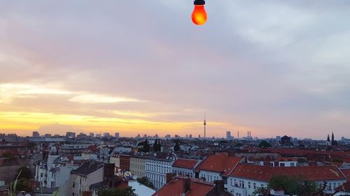 Cityscape against sky during sunset