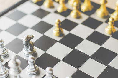 Close-up of chess pieces on board