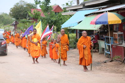 Rear view of people walking outdoors