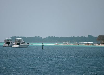 Boats sailing in sea