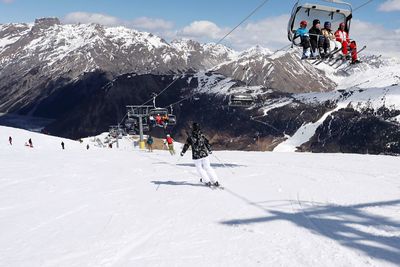 People on snowcapped mountains