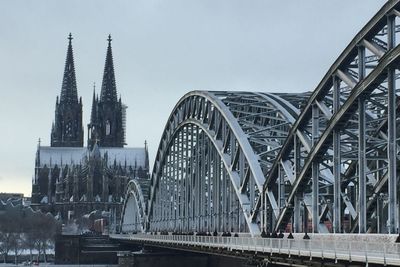 View of bridge in city against sky