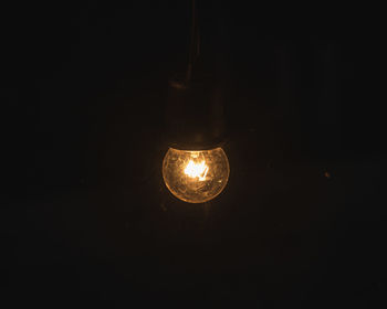 Close-up of illuminated light bulb