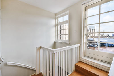 Empty chairs and table against window at home