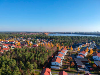 High angle view of townscape against clear blue sky