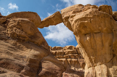 Low angle view of rocks against sky