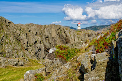 Varnes fyr lighthouse peeps out of the rocky terrain 