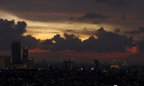 Silhouette of city at sunset