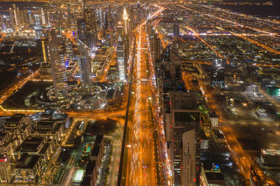 Aerial view of illuminated cityscape at night