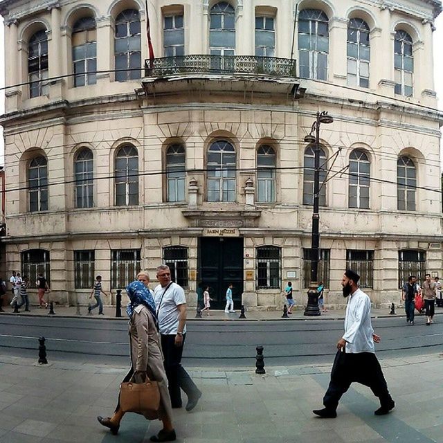 architecture, building exterior, built structure, men, person, walking, lifestyles, large group of people, leisure activity, city life, city, full length, building, street, arch, window, facade, tourist, day