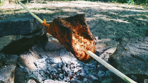 High angle view of meat on barbecue grill