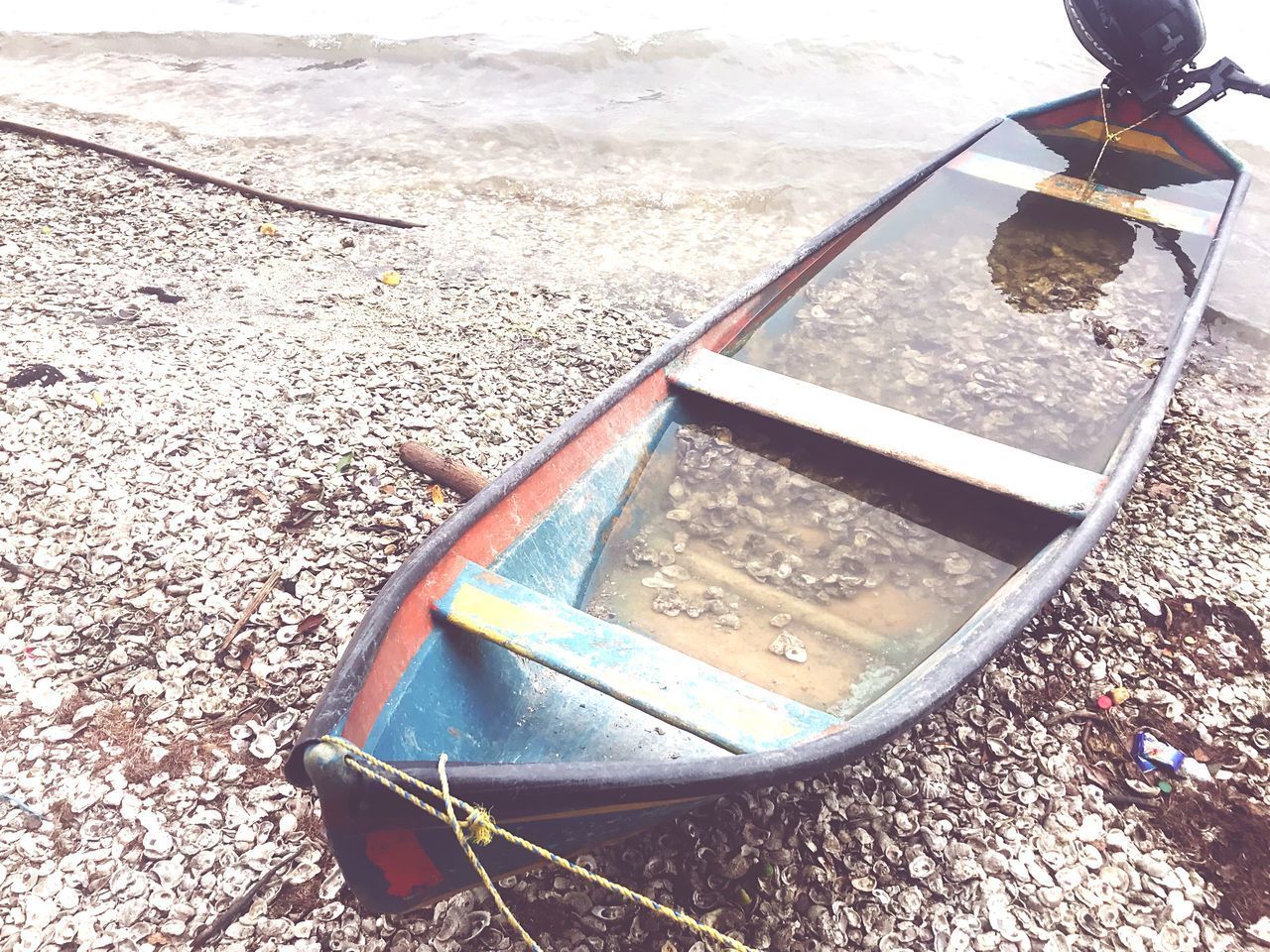 CLOSE-UP HIGH ANGLE VIEW OF ABANDONED BOAT