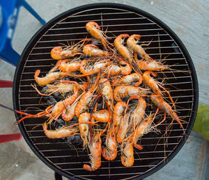 High angle view of meat on barbecue grill