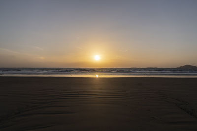 Scenic view of beach during sunset