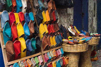 Colourful handmade moroccan leather shoes on shelf for sale, essaouira, morocco.
