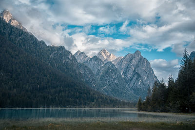 Scenic view of lake and mountains against sky