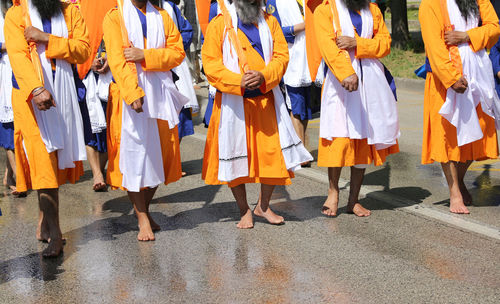 People standing on street in city