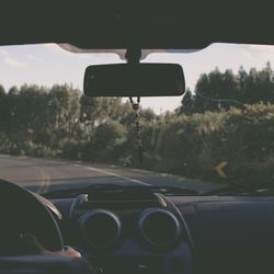 Cropped image of car on road