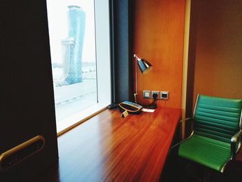 High angle view of empty chairs and table at home