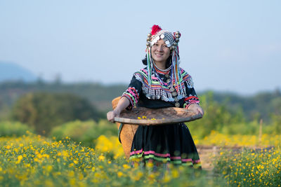 Full length of woman standing on field