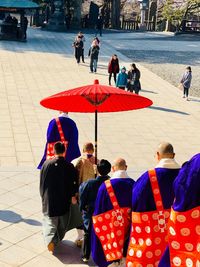 People walking on street in city