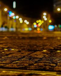 Close-up of illuminated street lights at night