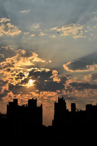 Silhouette of buildings at sunset