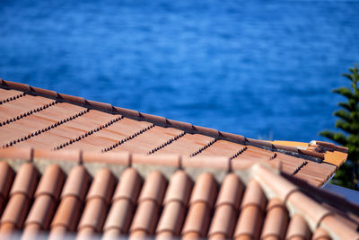 Low angle view of roof against blue sky