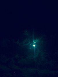 Low angle view of illuminated tree against sky