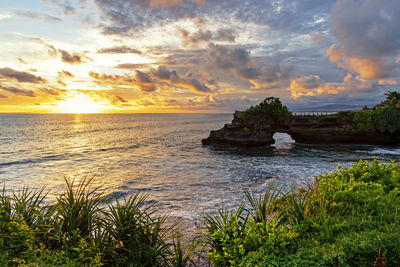 Scenic view of sea against sky during sunset