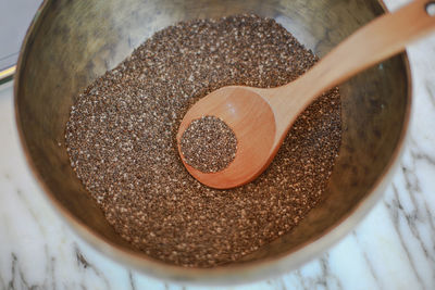 High angle view of coffee beans in container on table