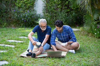 Friends sitting on grass