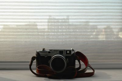 Close-up of camera on wall