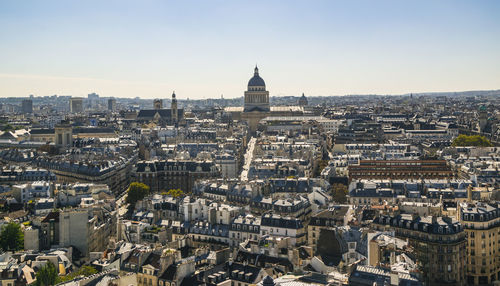 High angle view of city buildings against sky