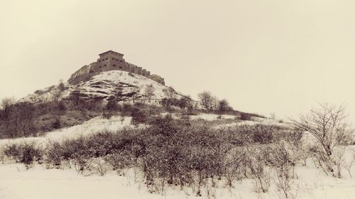 Scenic view of mountain against clear sky during winter