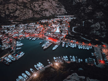 High angle view of illuminated buildings in city at night